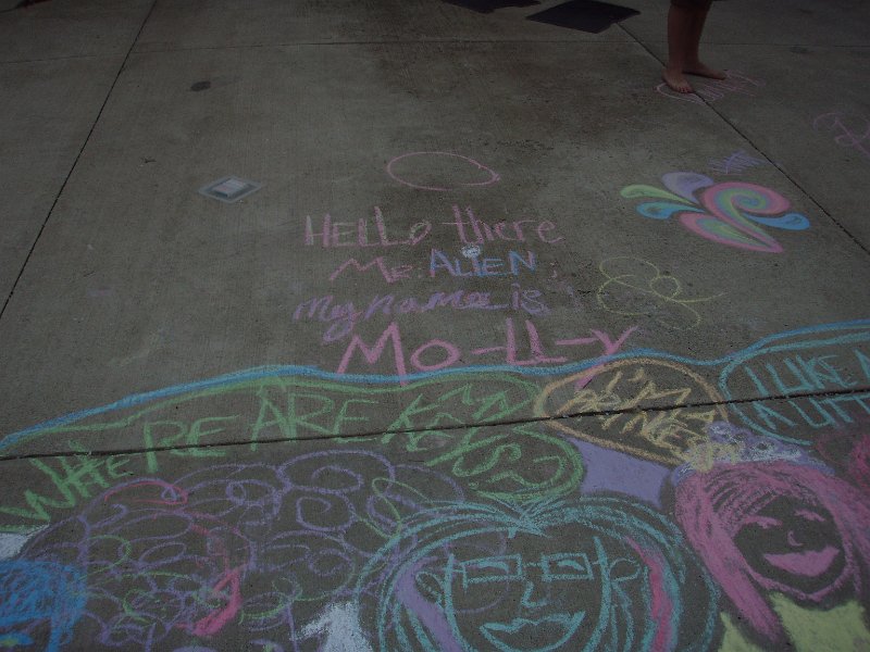 Molly creates a masterpiece of chalk art on the driveway.